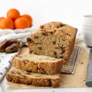 sliced date bread on a cooling rack.