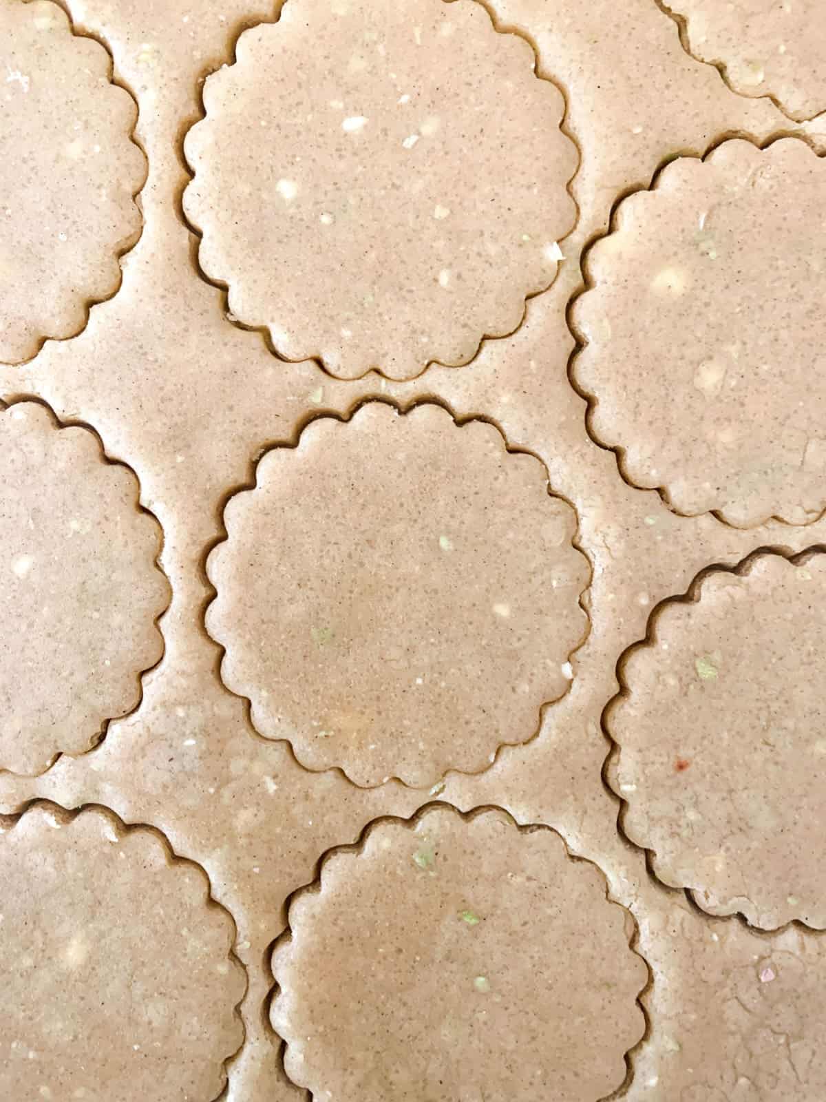 Apple sugar cookie dough with cut-outs.