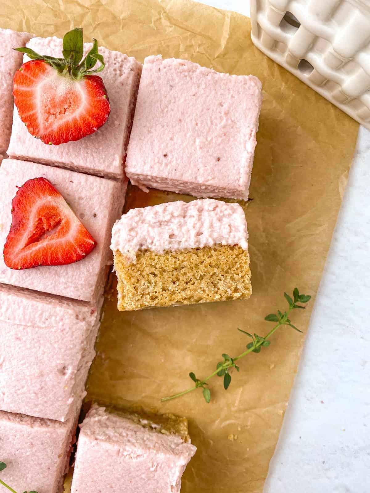 Sliced Strawberry Thyme Blondies from overhead with one slice turned on its side