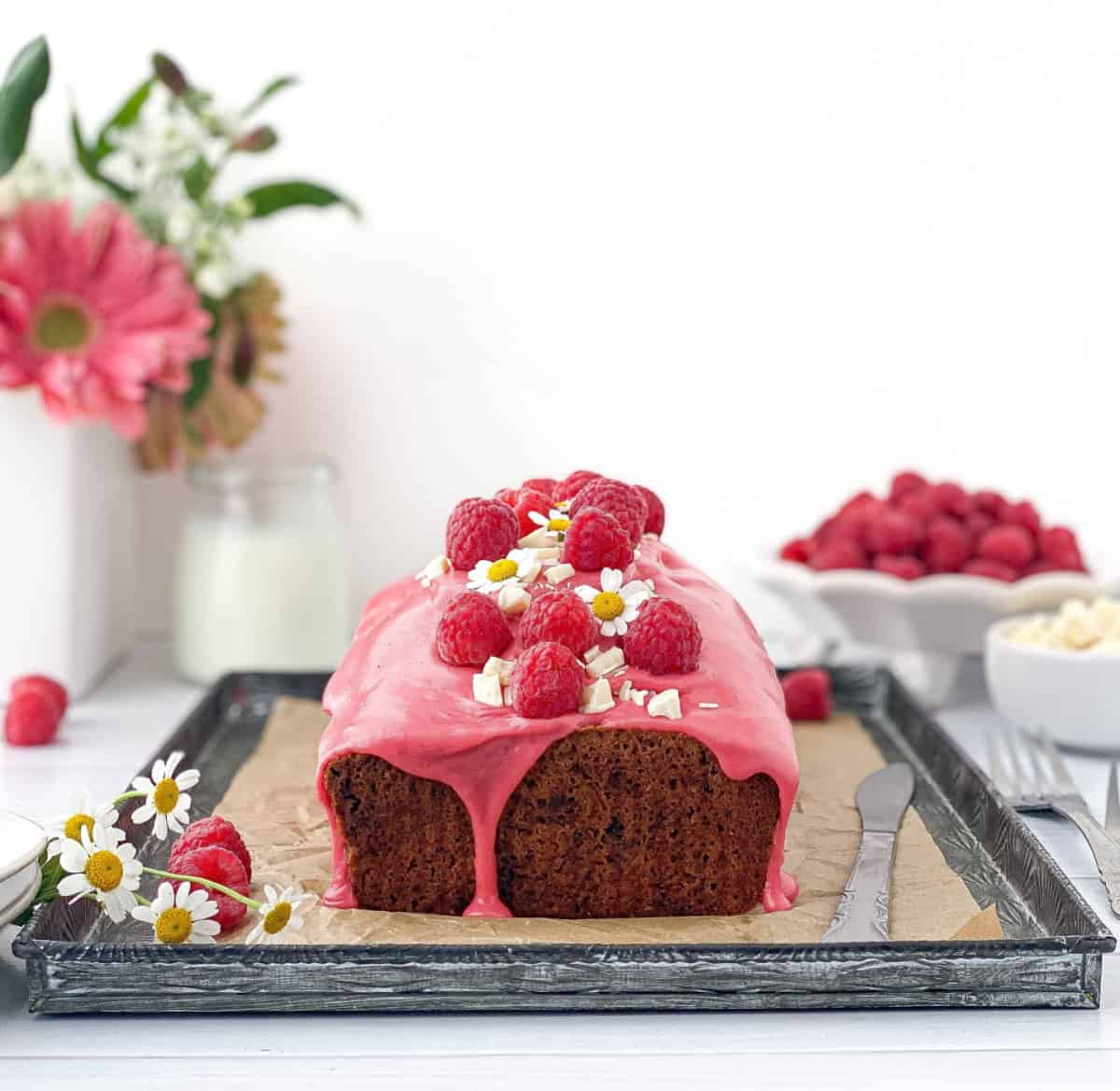 Raspberry and White Chocolate Loaf Cake on a tray.
