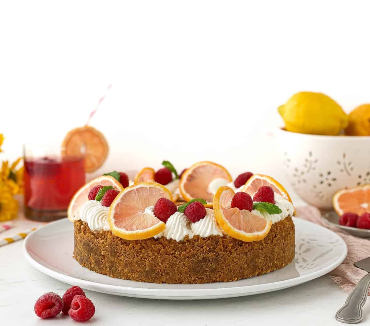 Raspberry Lemonade Cheesecake on a white serving plate.