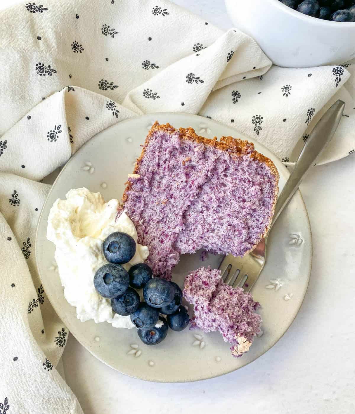 Top view of slice of Blueberry Angel Food Cake.