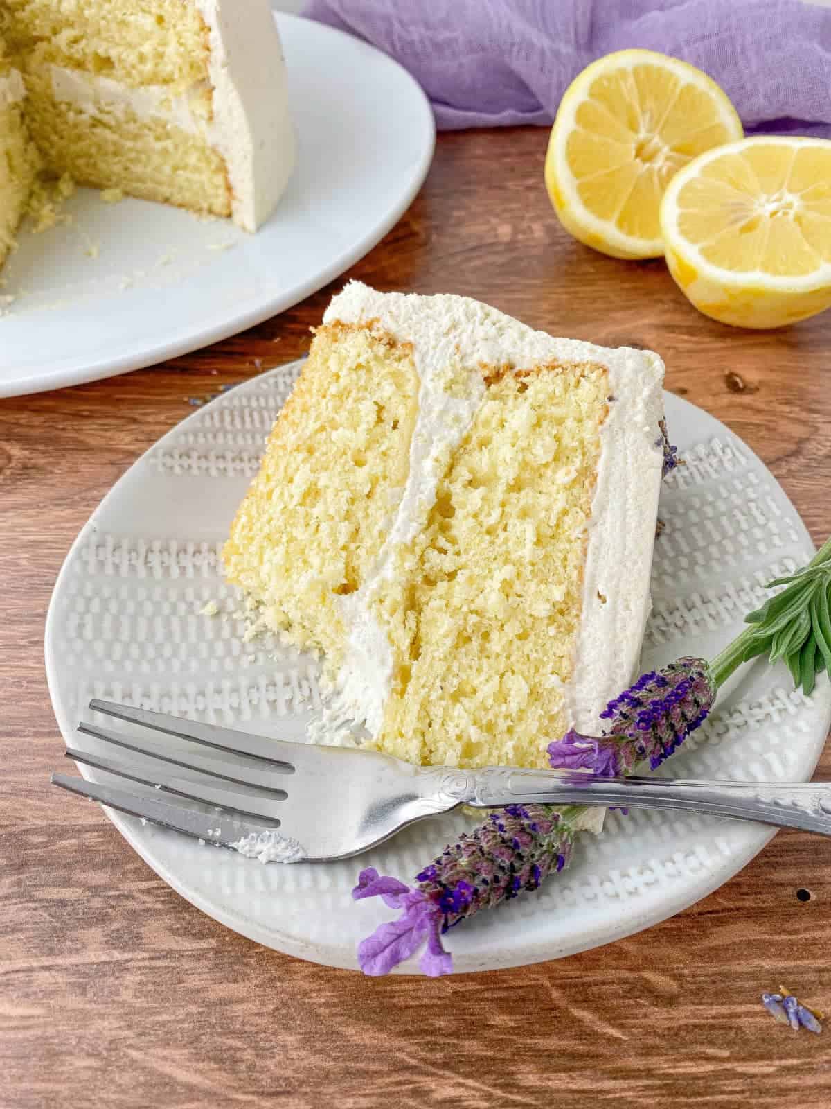 Slice of Lavender Lemon Cake with a bite missing.