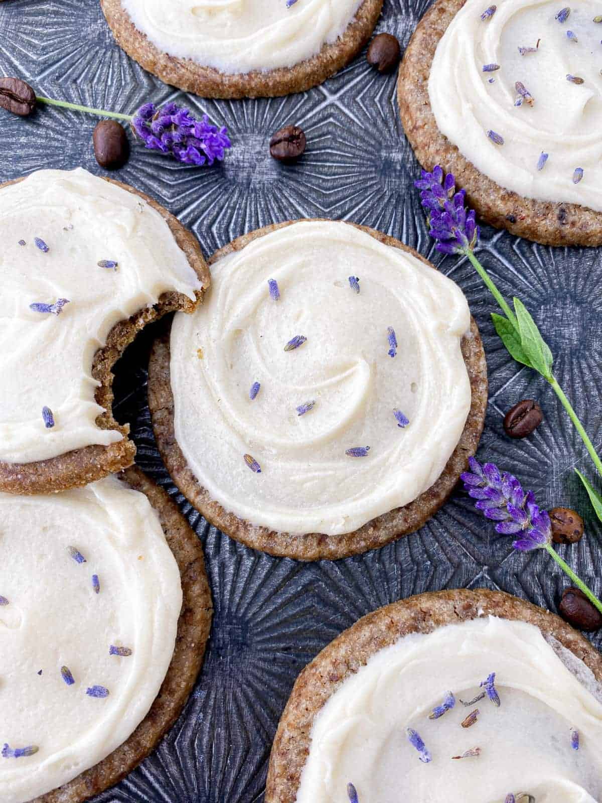 Honey Lavender Latte Cookies on a pan with fresh lavender and espresso beans.
