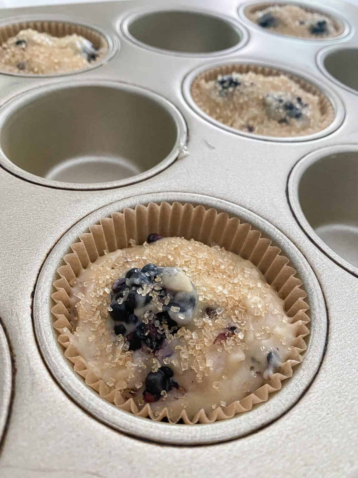 Closeup of Blackberry Buttermilk Muffin batter in pan.