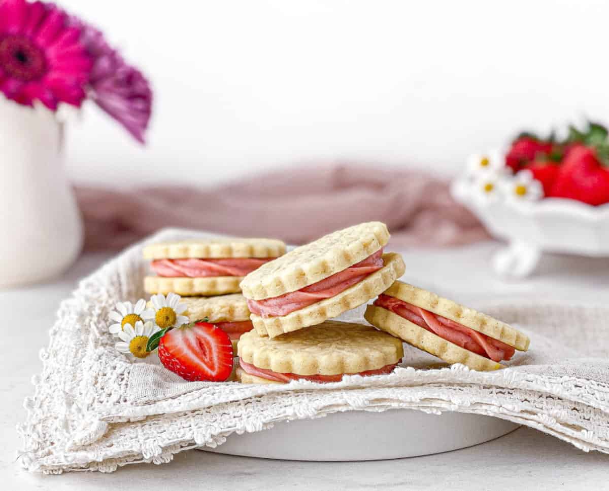 Strawberry Cheesecake Cookies on a white plate with a lace-edged napkin.