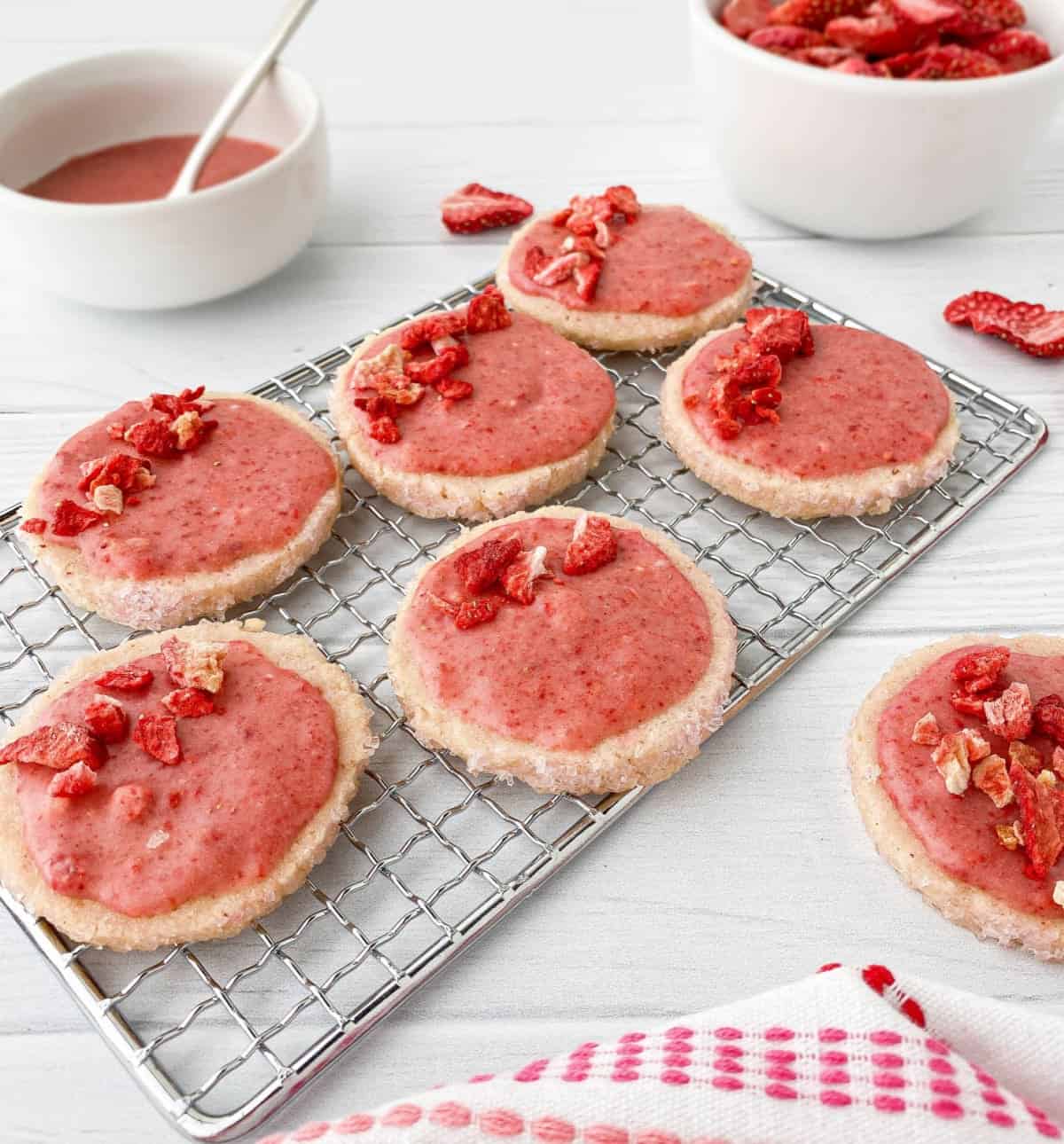 Strawberry Shortbread with strawberry glaze on top on a cooling rack.