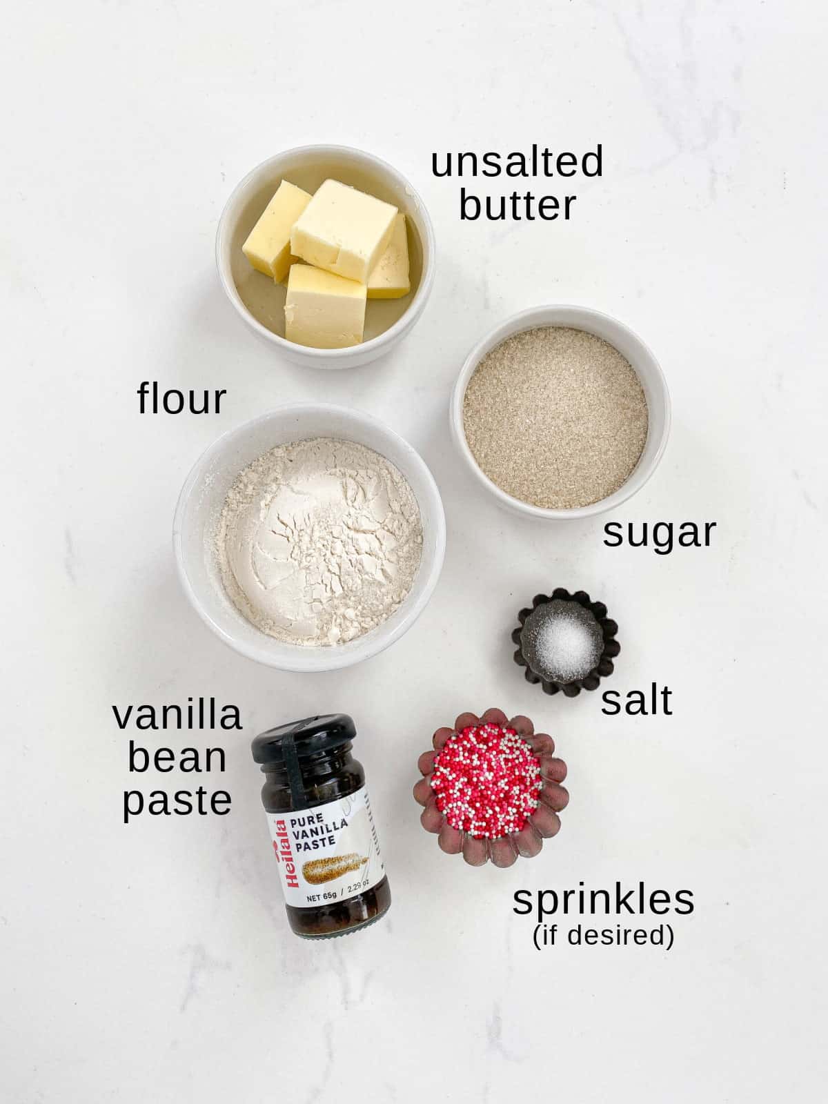 Edible sugar cookie dough ingredients on a white background.
