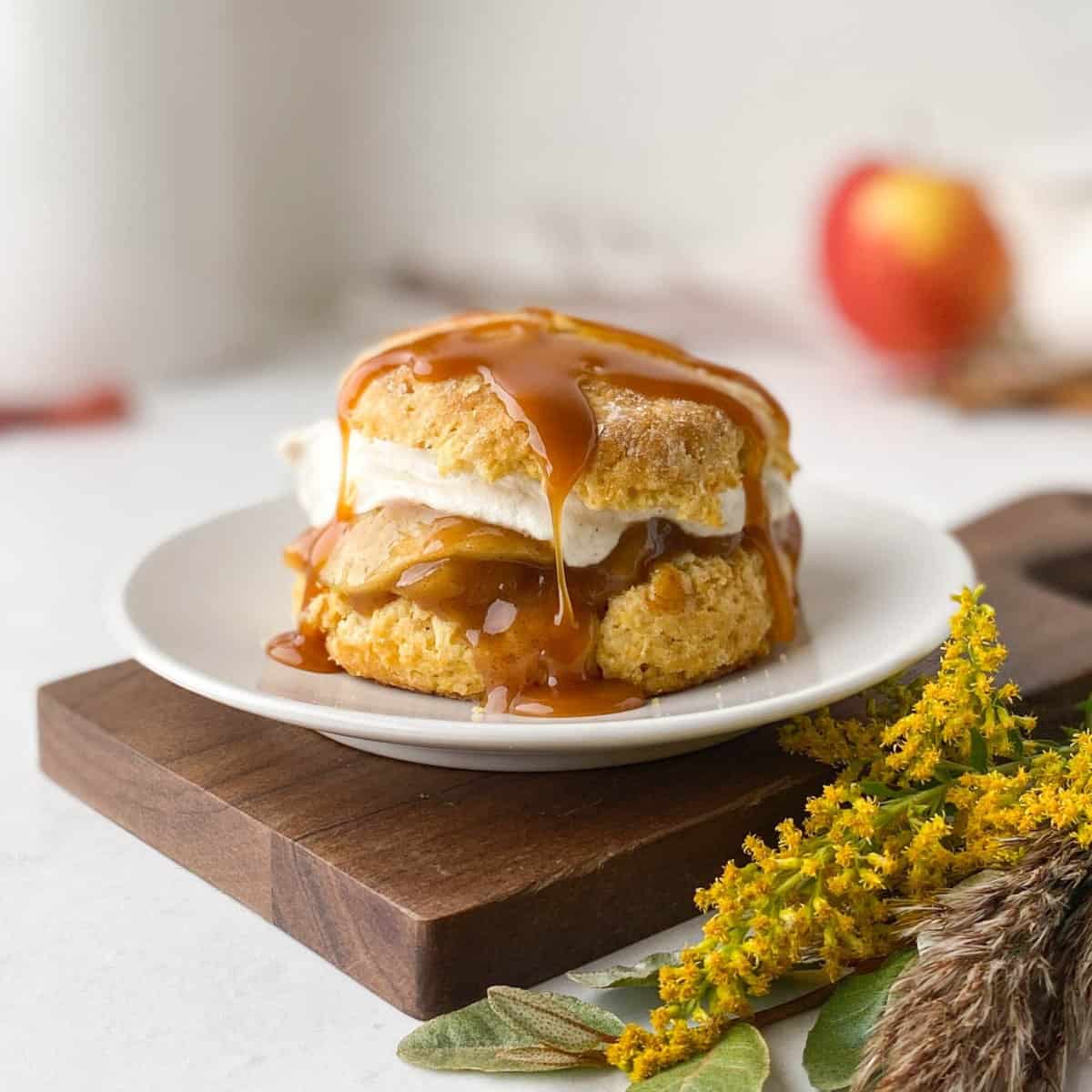 Apple Shortcake drizzled with salted caramel sauce on a white plate.