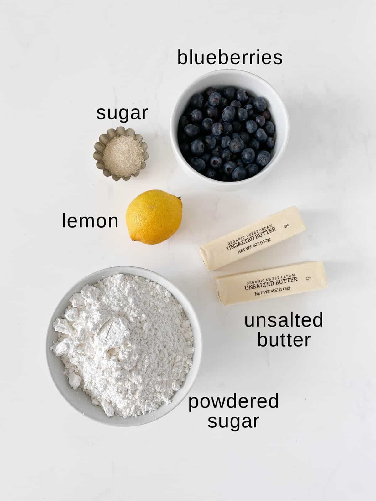Blueberry buttercream ingredients on a white background.