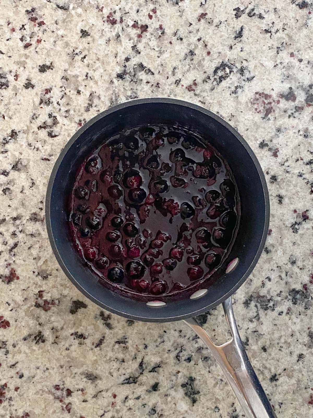 Making blueberry buttercream, step 1.